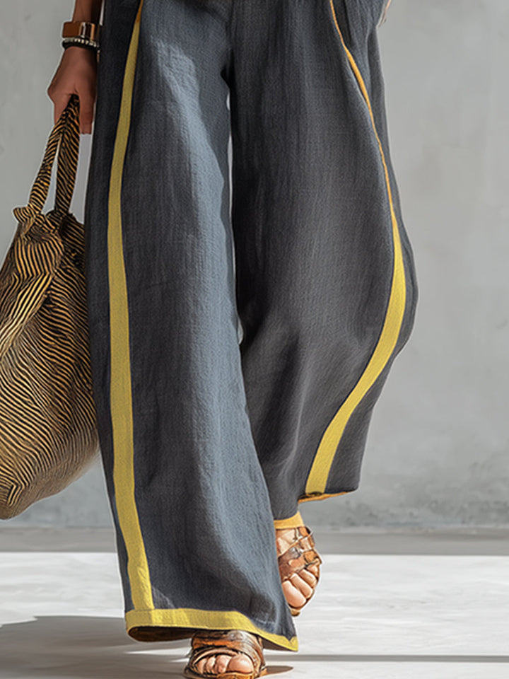 Natalia | Completo fluido grigio con top senza maniche e pantaloni larghi