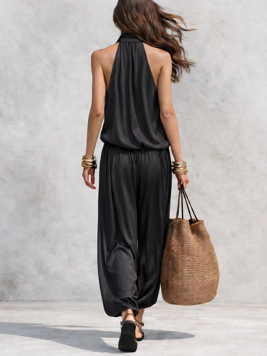 Raquel | Completo fluido nero con top senza maniche e pantaloni larghi